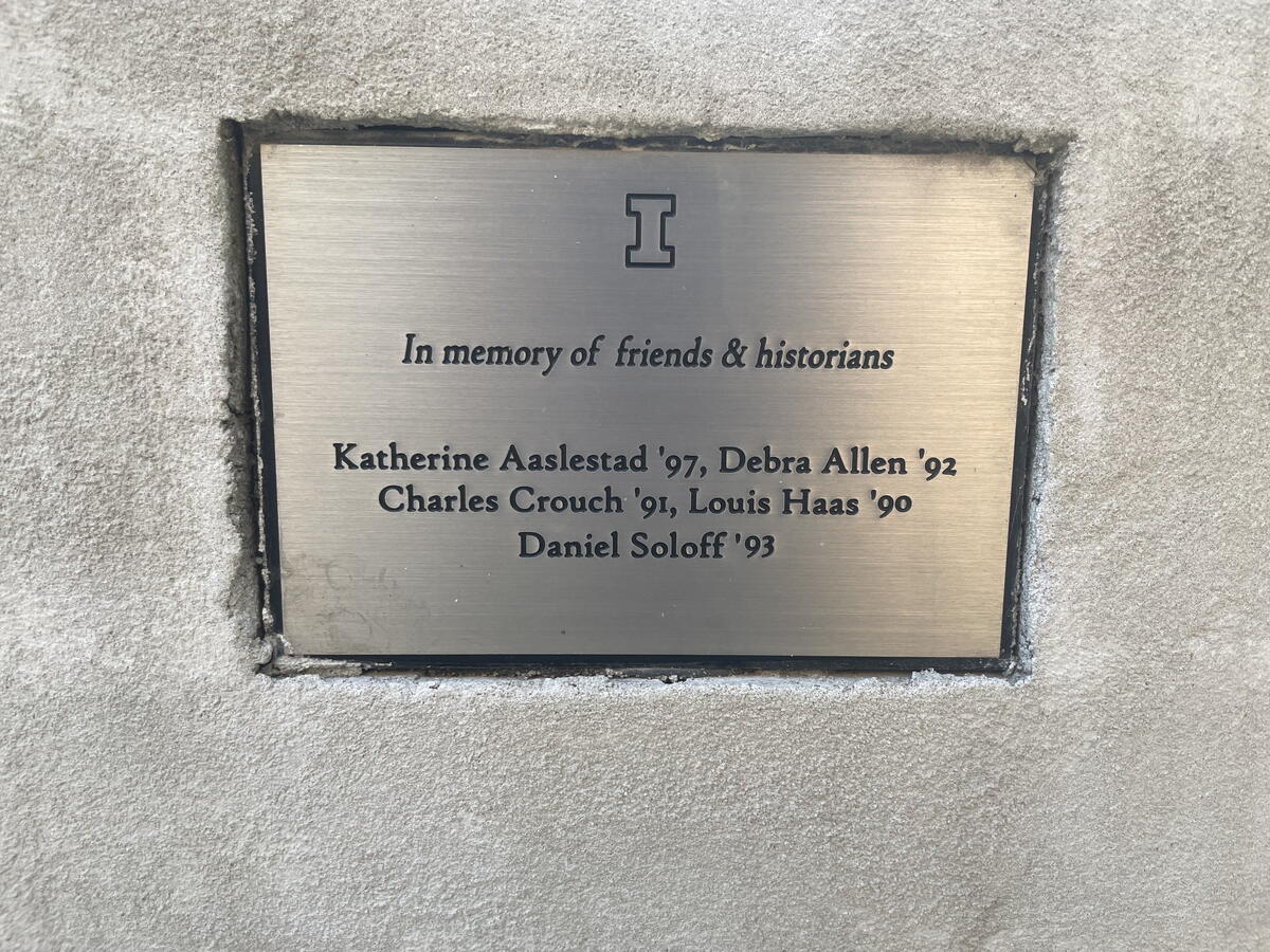 Close up image of plate on memorial bench