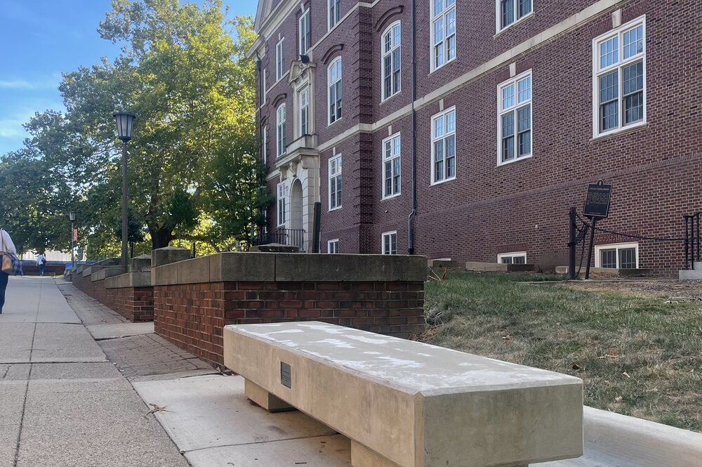 Memorial bench outside of Gregory Hall