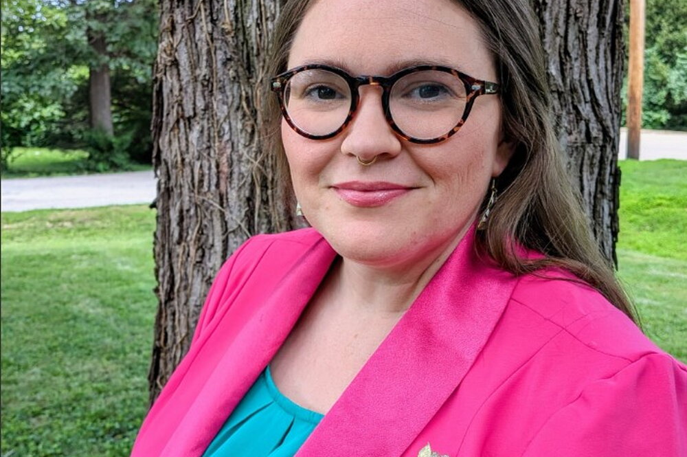 Shannan Mason stands in front of a tree
