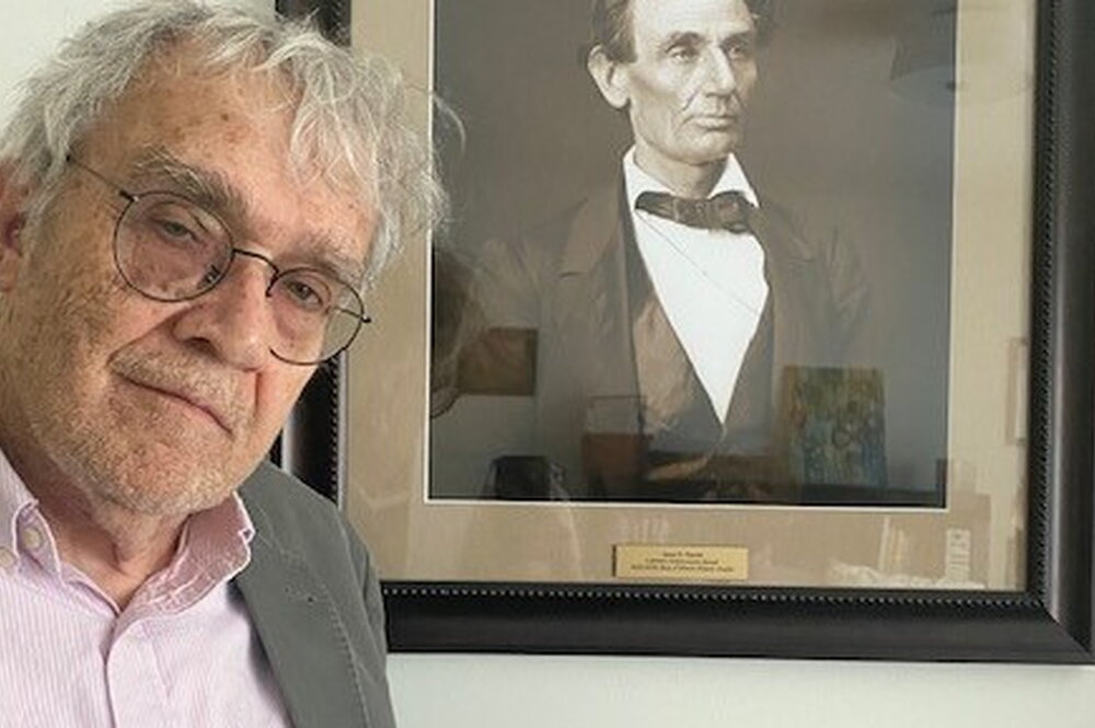 Jim Barrett with a photo of Abraham Lincoln