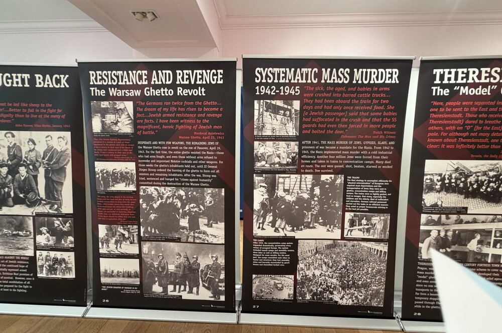 Panels of a museum exhibit describing the holocaust