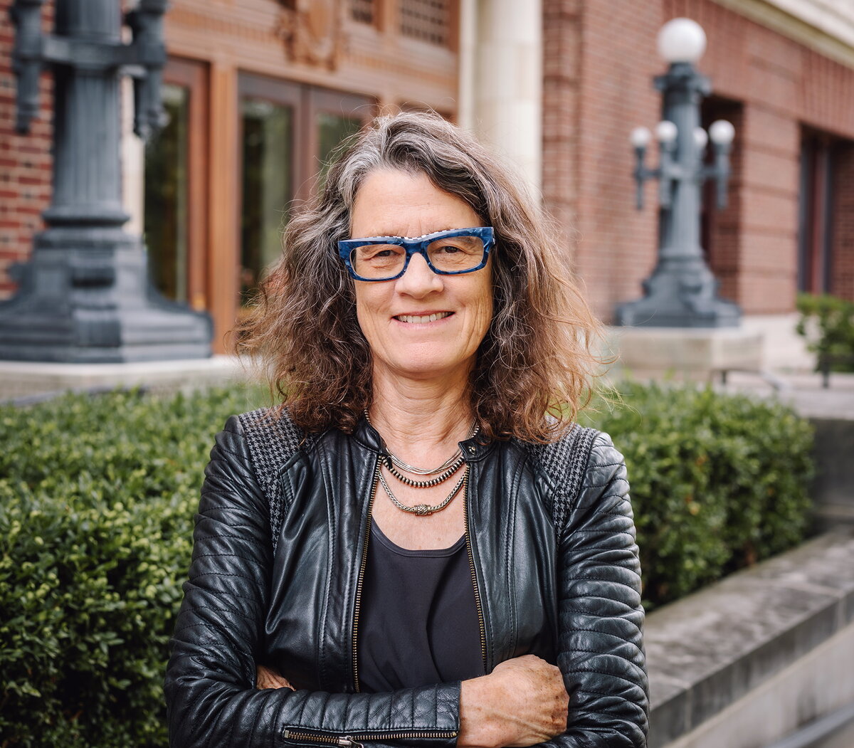 Leslie Reagan stands outside a university building