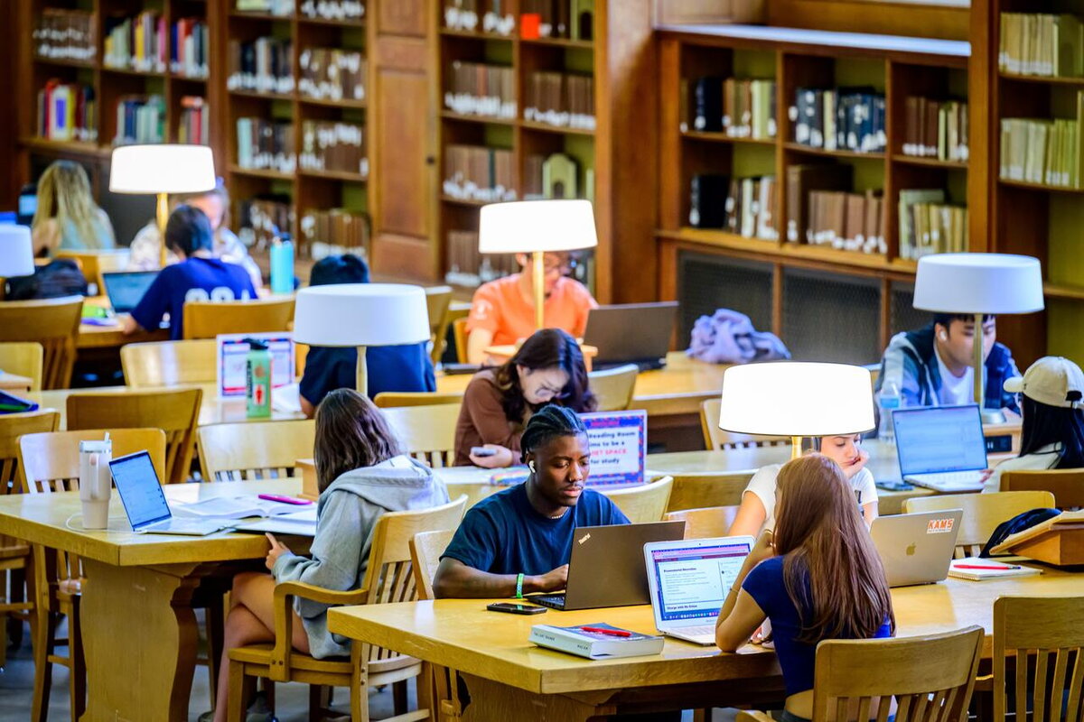 students studying in the main library reading room