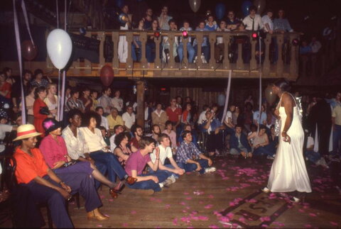 Drag performer in front of Crowd at the Bar on valentine's day