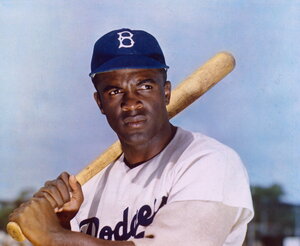 Jackie Robinson holding a baseball bat