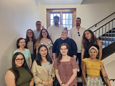 graduate students on the steps of greg hall.