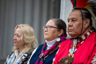 Rosalyn LaPier and two other people at the dedication ceremony.