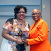 Mikki Kendall accepts an award from Dean Venetria Patton
