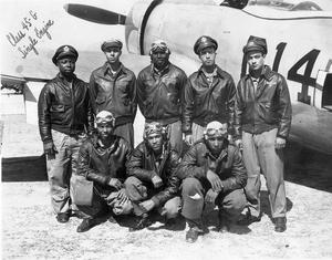 Tuskegee Airmen, in front of a P-47 fighter plane. WWII