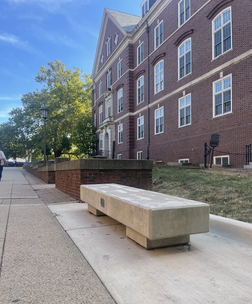 Memorial bench outside of Gregory Hall