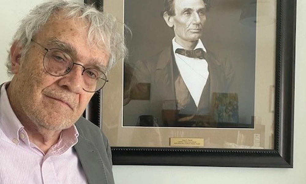 Jim Barrett with a photo of Abraham Lincoln