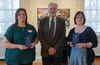 Shannon Croft and Michelle Tomaszycki pose with their awards with Dean Wojtek Chodzko-Zajko