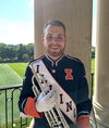 Colin holds an instrument
