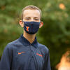 Evan, pictured on the quad wearing a mask 