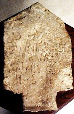 A stone tablet with an inscription.