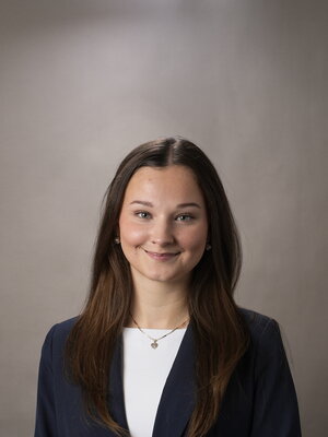 Victoria smiling for a headshot