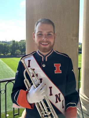 Colin holds an instrument